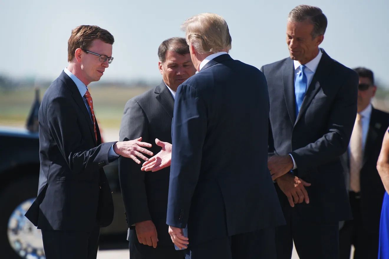 South Dakota Rep. Dusty Johnson shakes hands with President Donald Trump