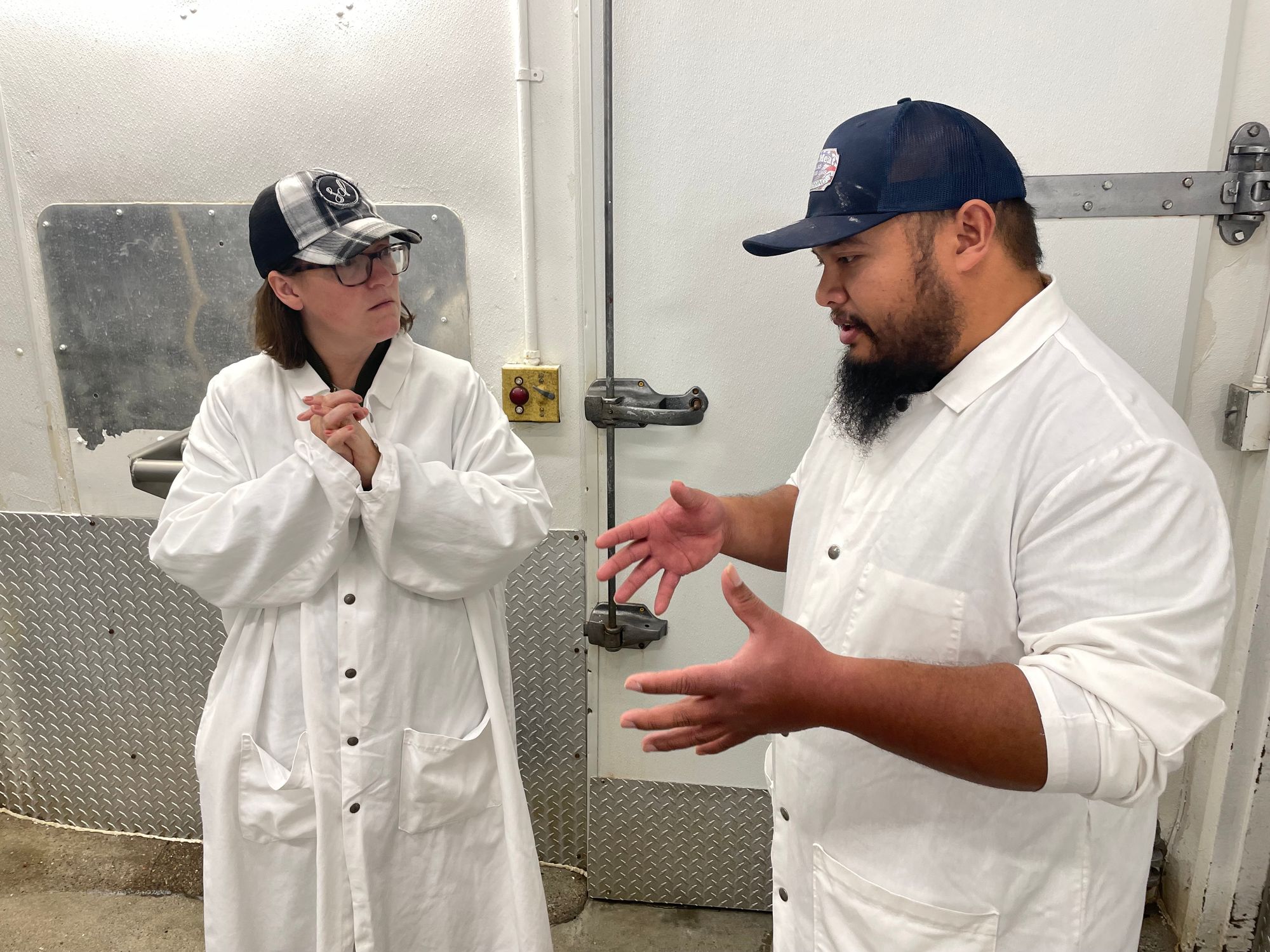 Laura Moser speaks with Wall Meat Processing manager Chris Charfauros.