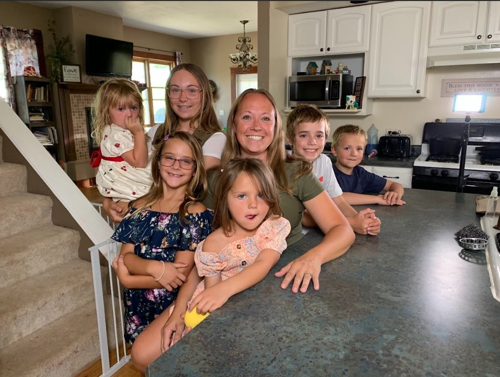 Stephanie Wiegand takes a photo with her six children in her Lead home