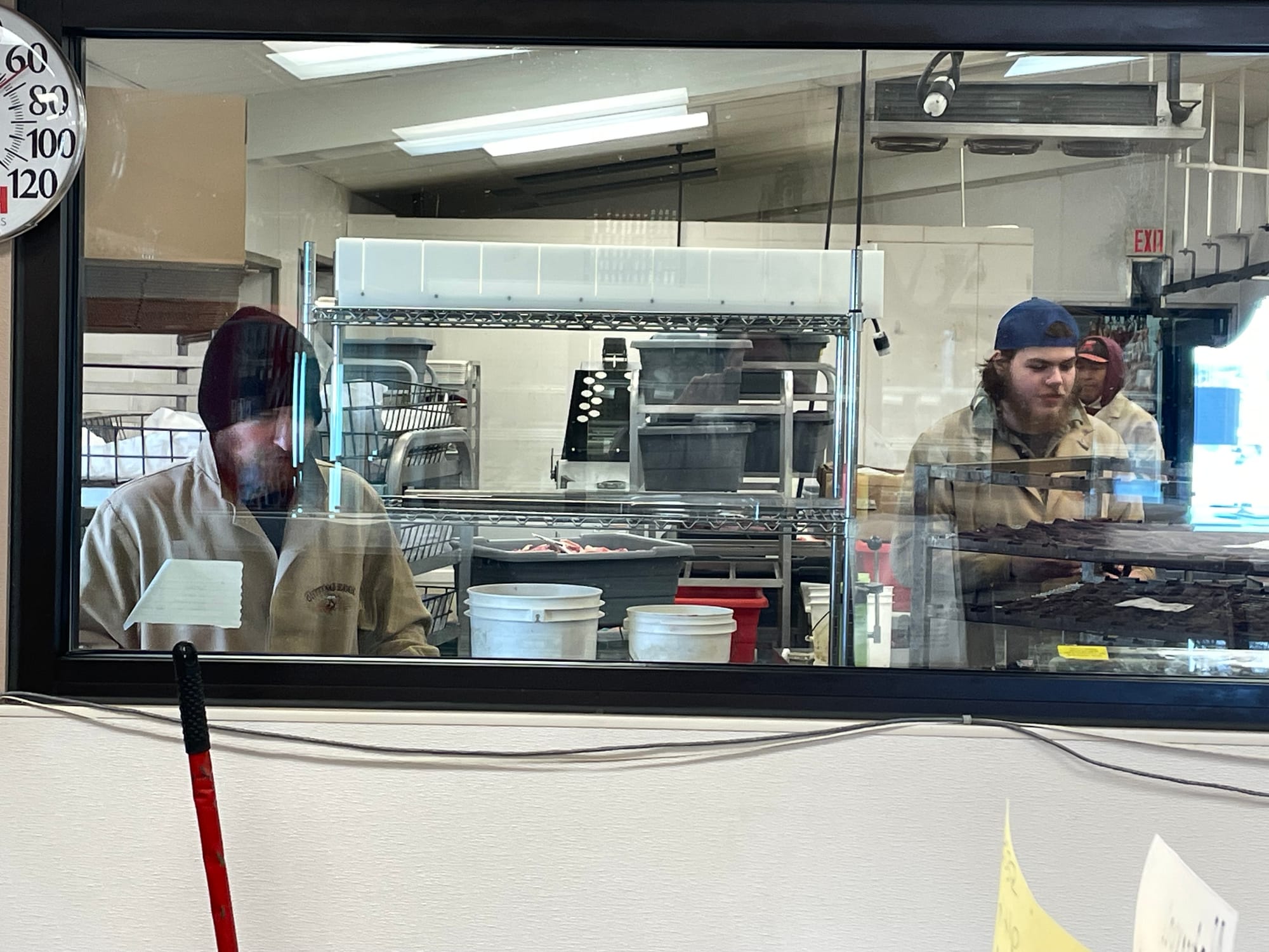 Workers at Cutting Edge Meat Market in Piedmont, South Dakota, process meat.