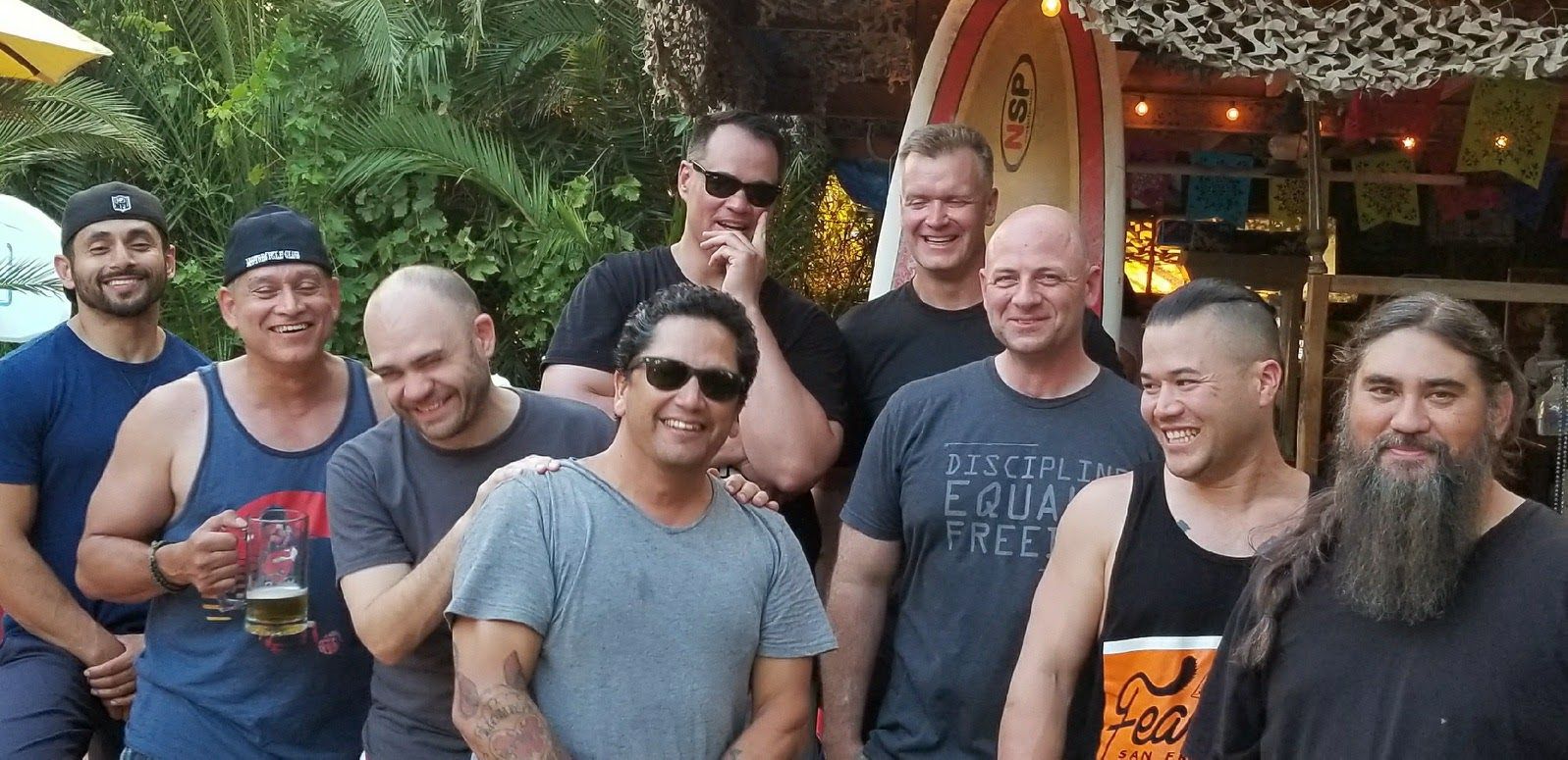 A group photo featuring Chad Armstrong (back row with sunglasses), who formed the nonprofit Forgotten Fifteen Foundation