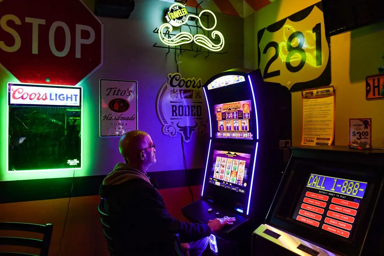 A man plays a video lottery machine in Sioux Falls, South Dakota.