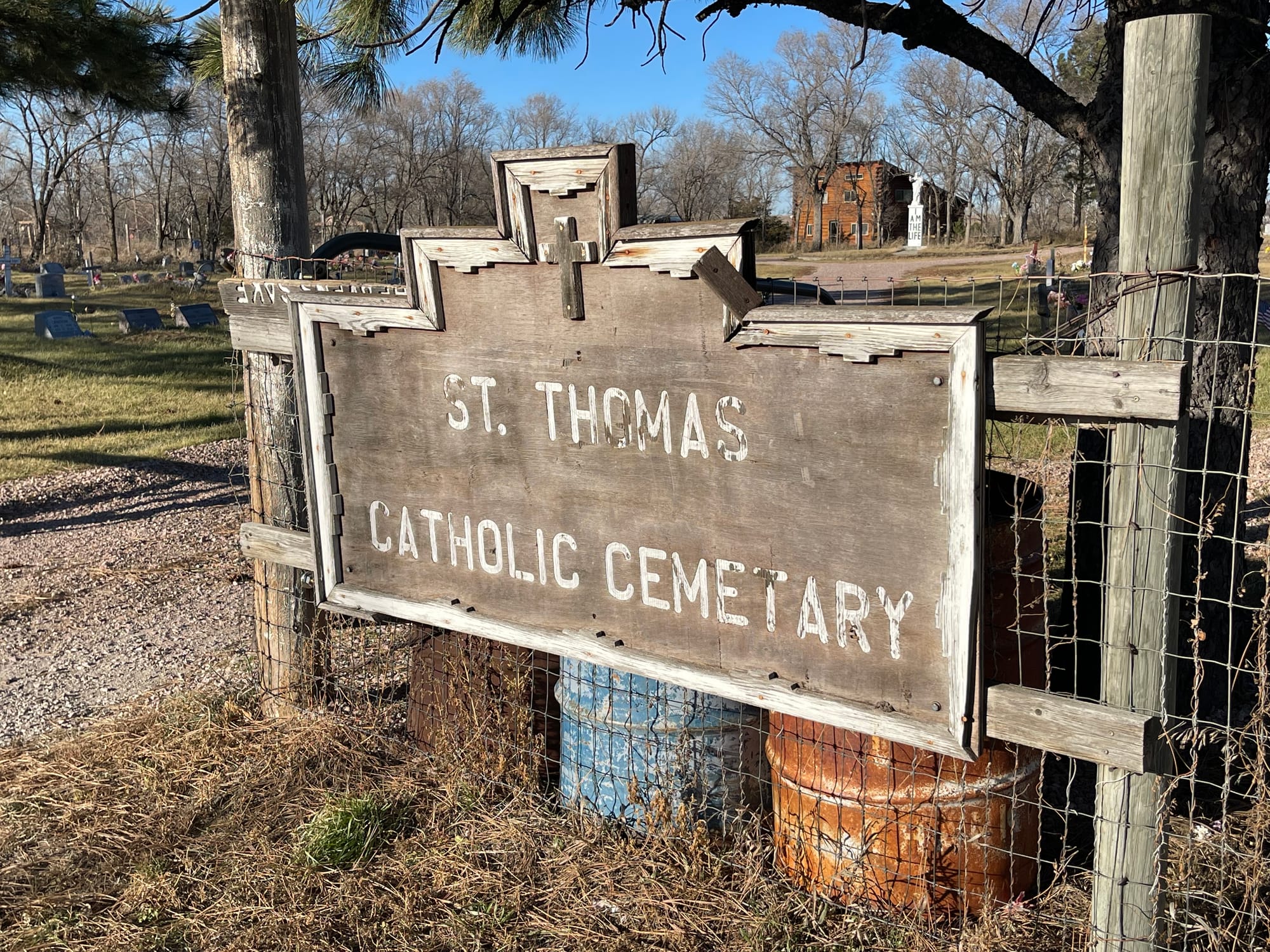 A sign at the St. Thomas Catholic Cemetery in Mission, South Dakota, where Honor Beauvais is buried.