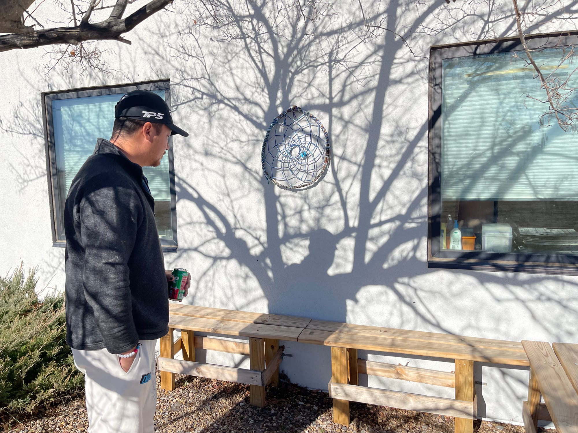 Gary Whipple shows a bench that Honor made with his classmates.