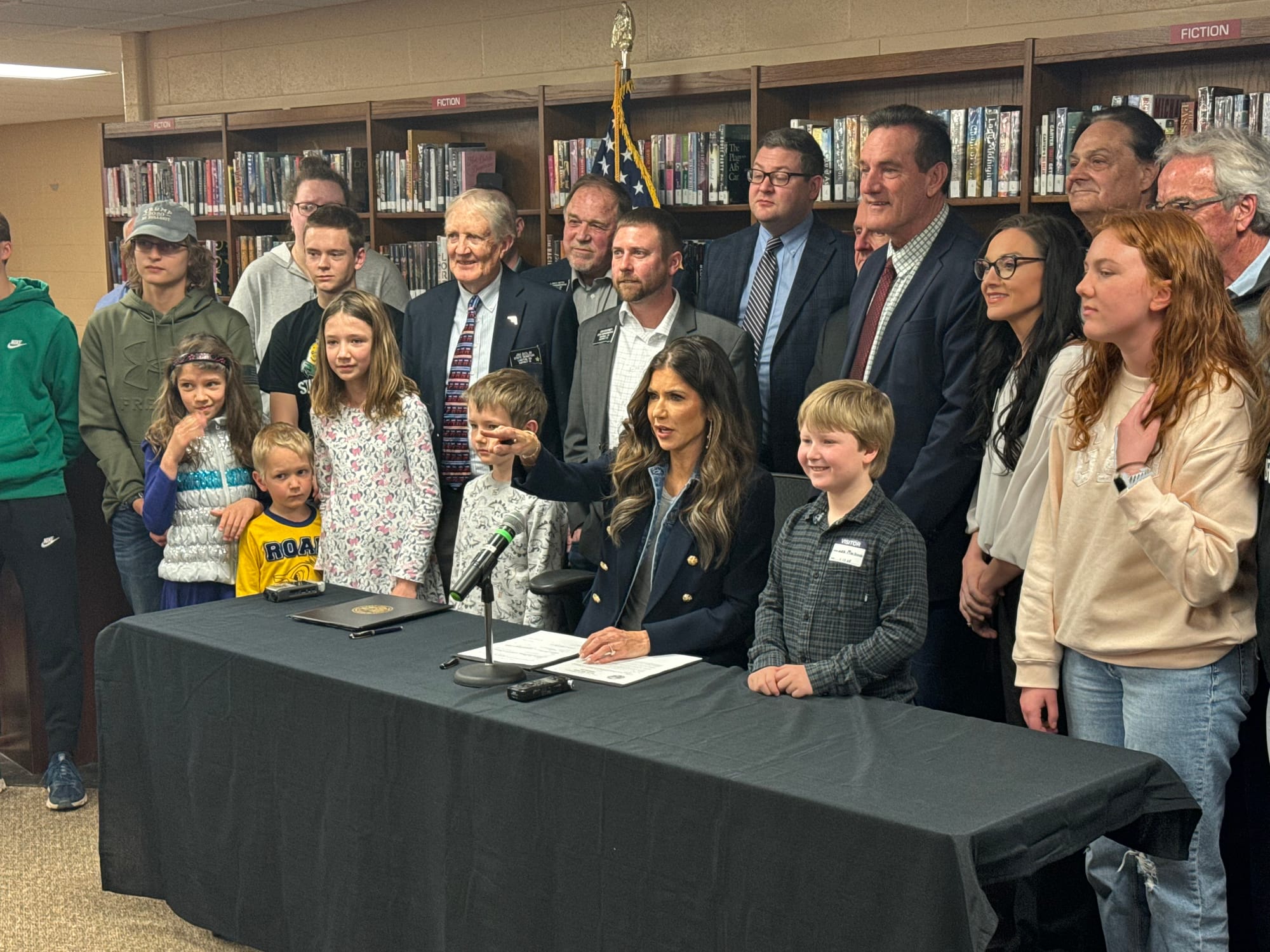 Gov. Kristi Noem poses with supporters and South Dakota legislators.