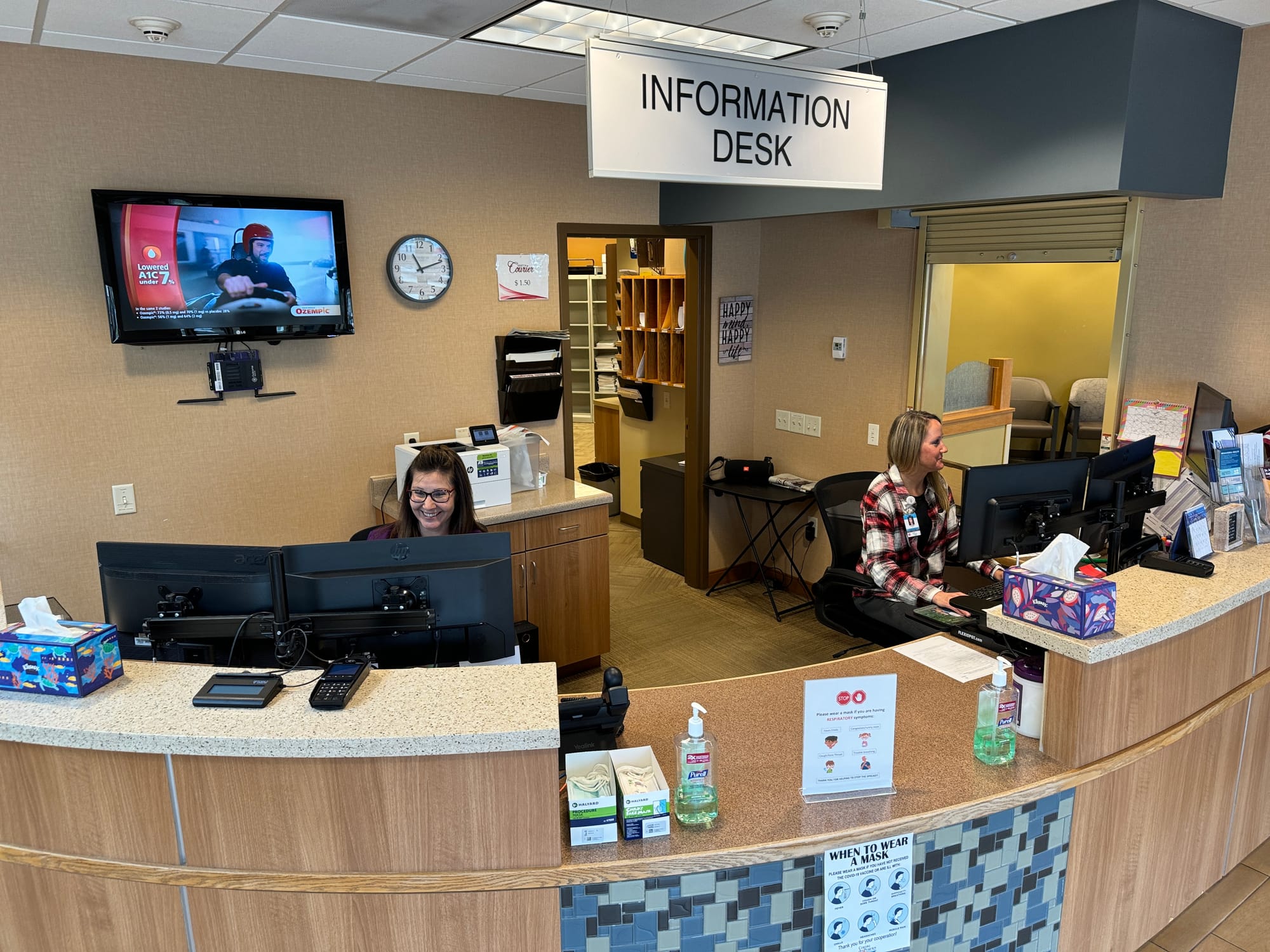 Employees work behind the counter at Decoteau des Prairies hospital in Sisseton, S.D., 