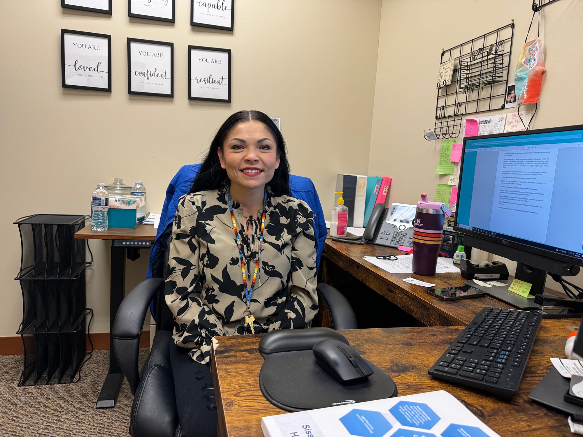 Elise Johnson sits at her desk in her Sisseton, S.D., office