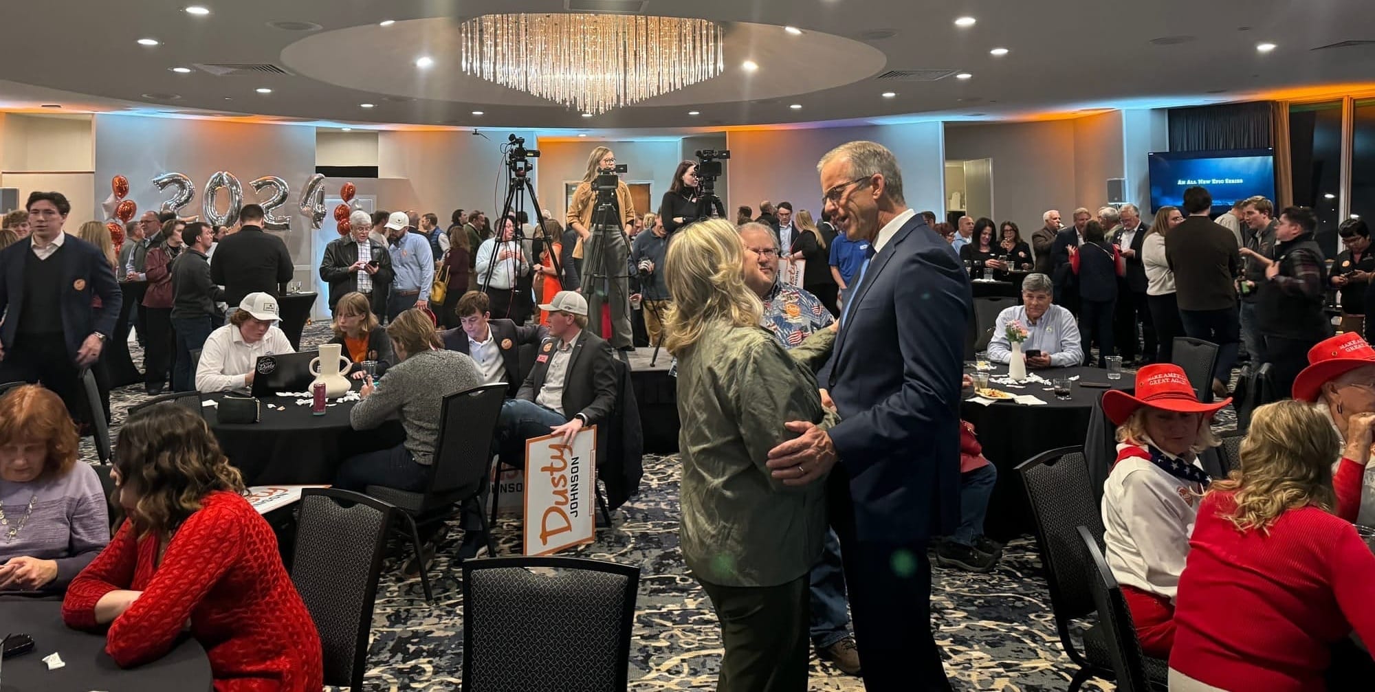 South Dakota U.S. Sen. John Thune talks with a supporter during U.S. Rep. Dusty Johnson's victory party at the Holiday Inn City Centre in Sioux Falls, S.D., on Nov. 5, 2024