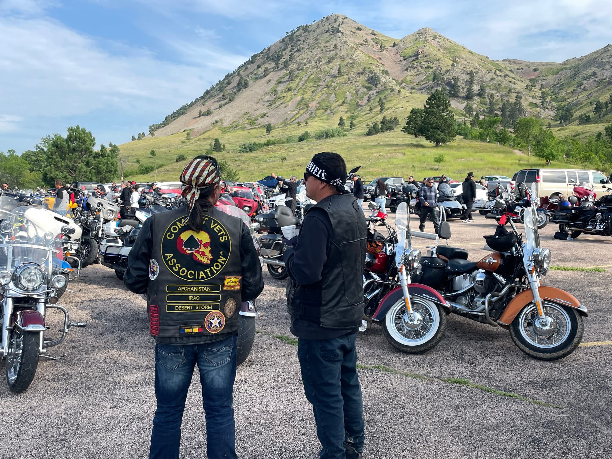 Motorcycle riders take in the view of Bear Butte doing the 2023 Sturgis, S.D., rally.