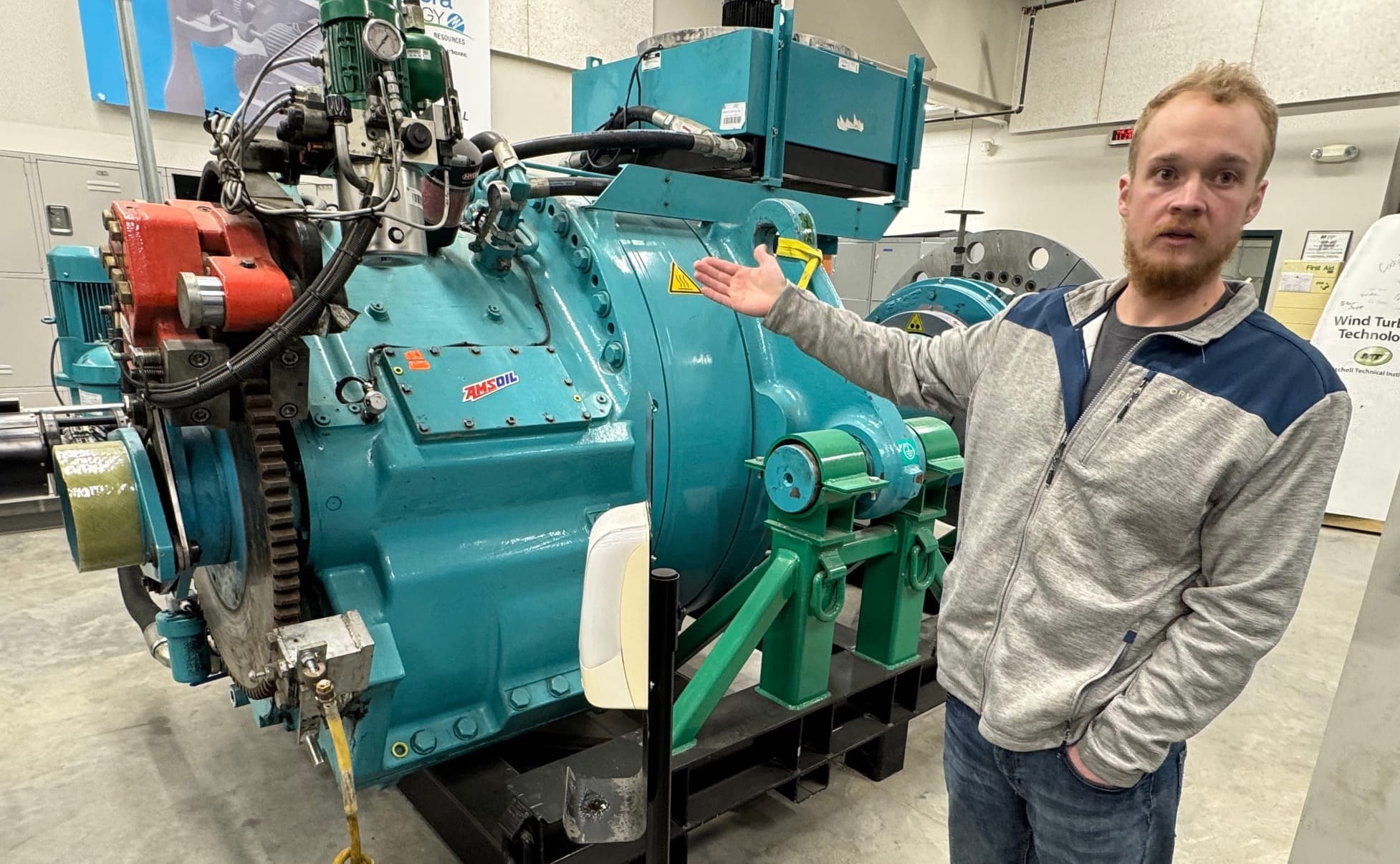 Matthew Pearson, an instructor in the wind technology program at Mitchell Tech in Mitchell, S.D., shows a turbine students can work on in a lab at the school