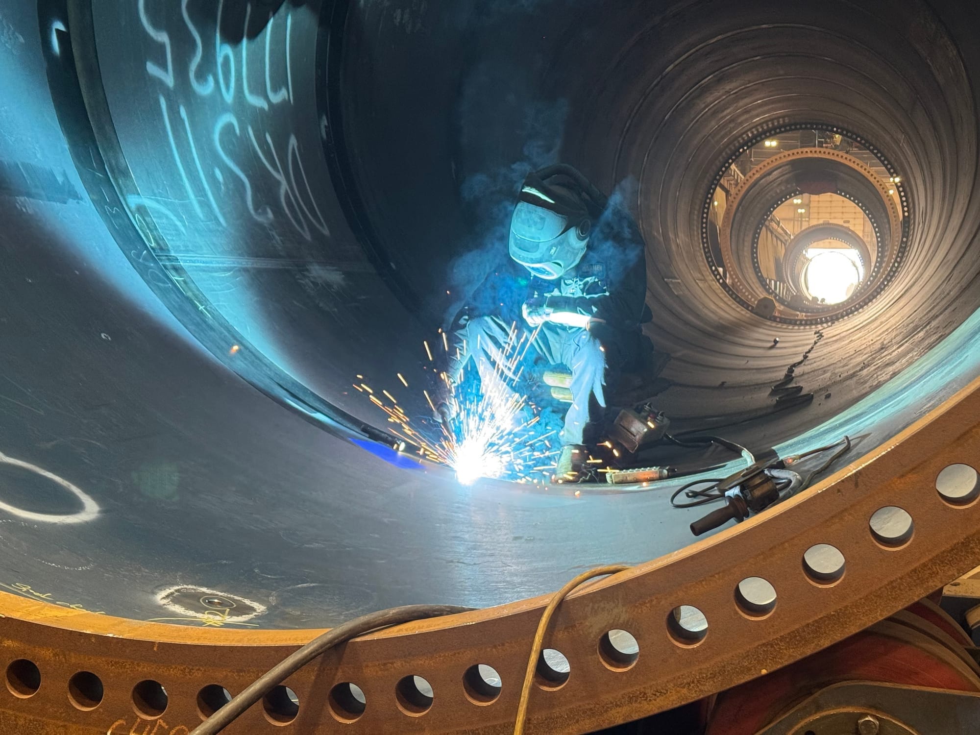 Welders, such as this one shown on April 9, 2025, make up a significant portion of the workforce at Marmen Energy in Brandon, S.D., where wind towers are manufactured.
