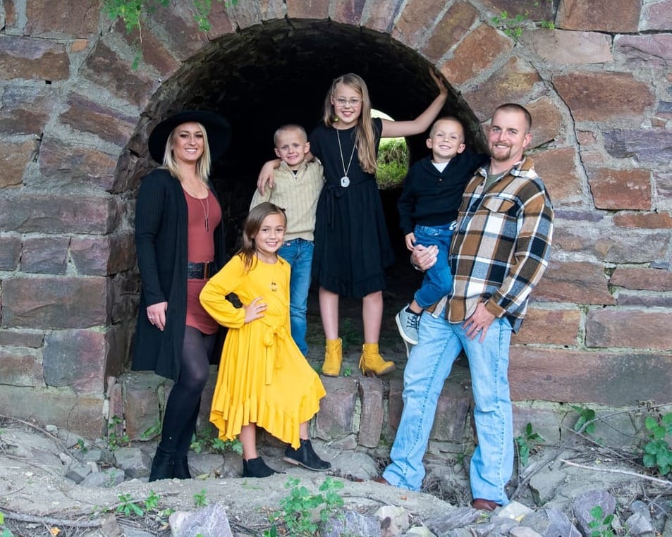 Grant and Sydney Lanning pose with their four children in Mitchell, S.D.