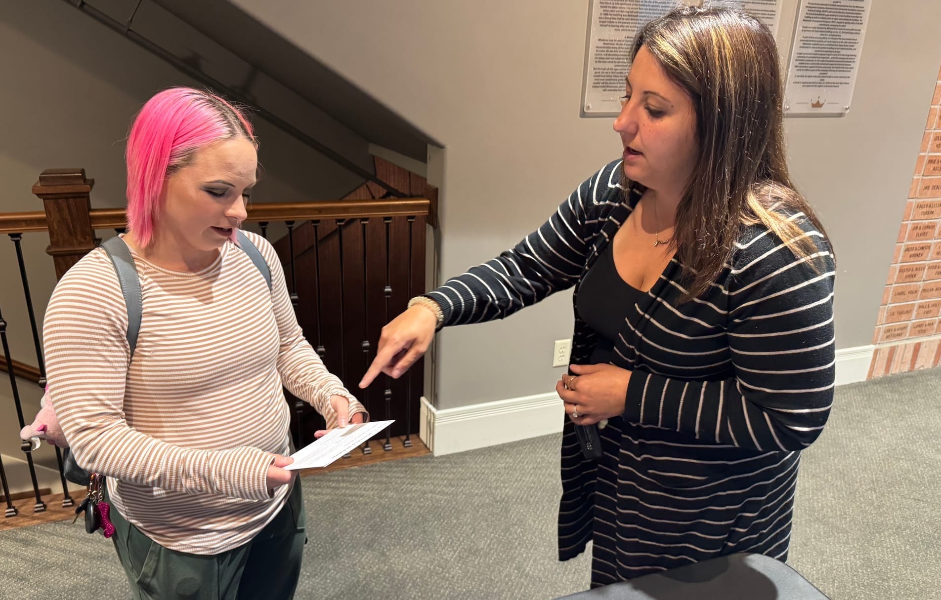 Lindsey Schwinger, left, speaks about the civic planning process with Anjelica Uthe, executive director of Visit Watertown, during a community meeting