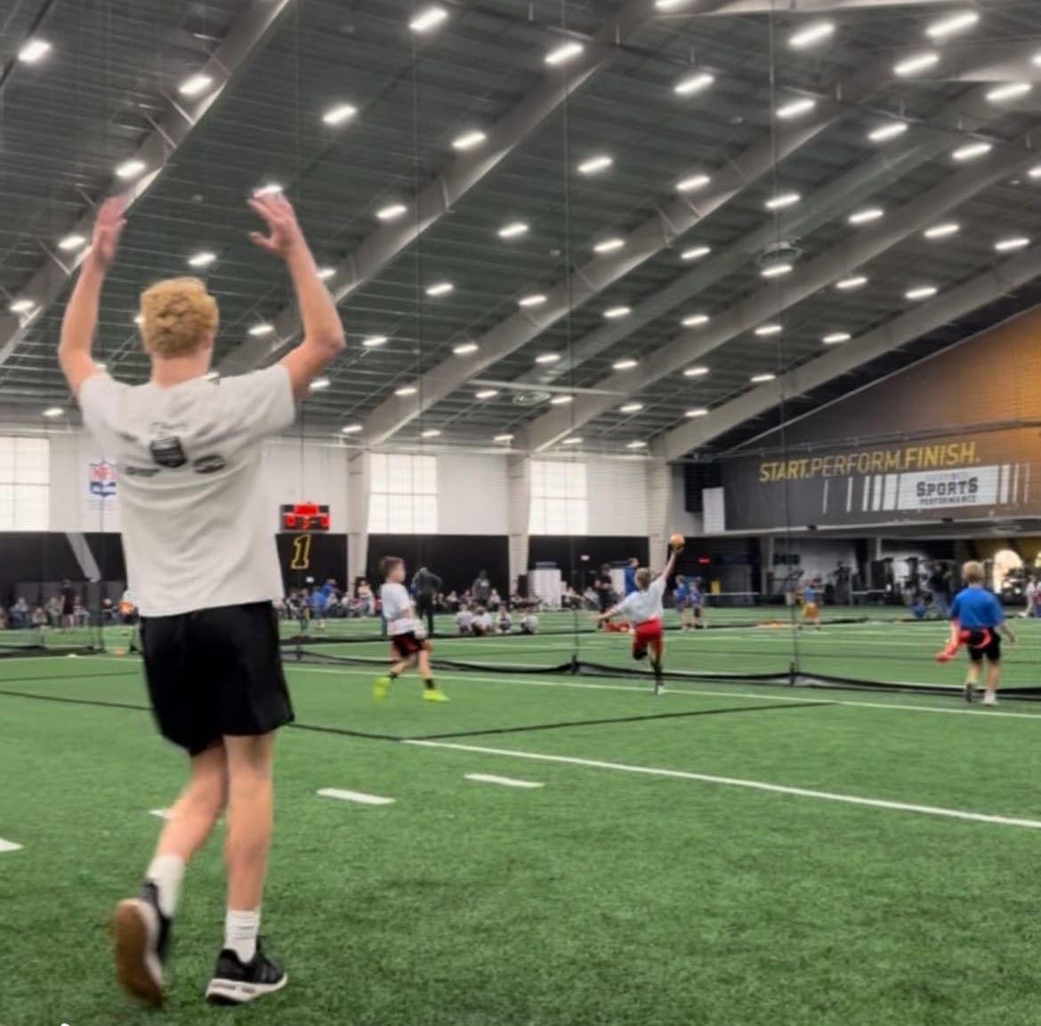 Inside the Sanford Fieldhouse in Sioux Falls, S.D., at a youth flag football practice. 