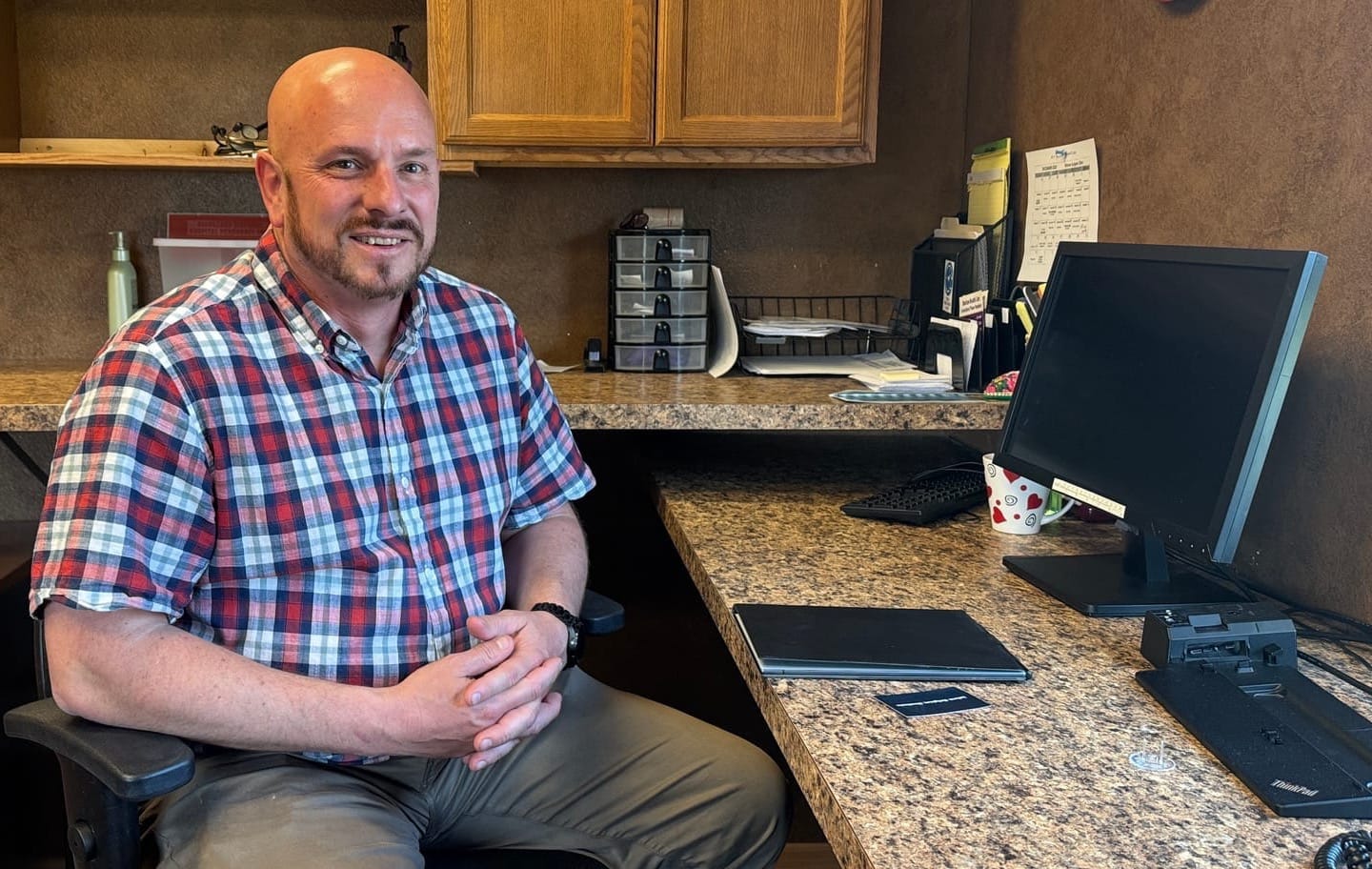 Wade Erickson, CEO of Horizon Health Care, sits at his desk at the office in Martin, South Dakota.