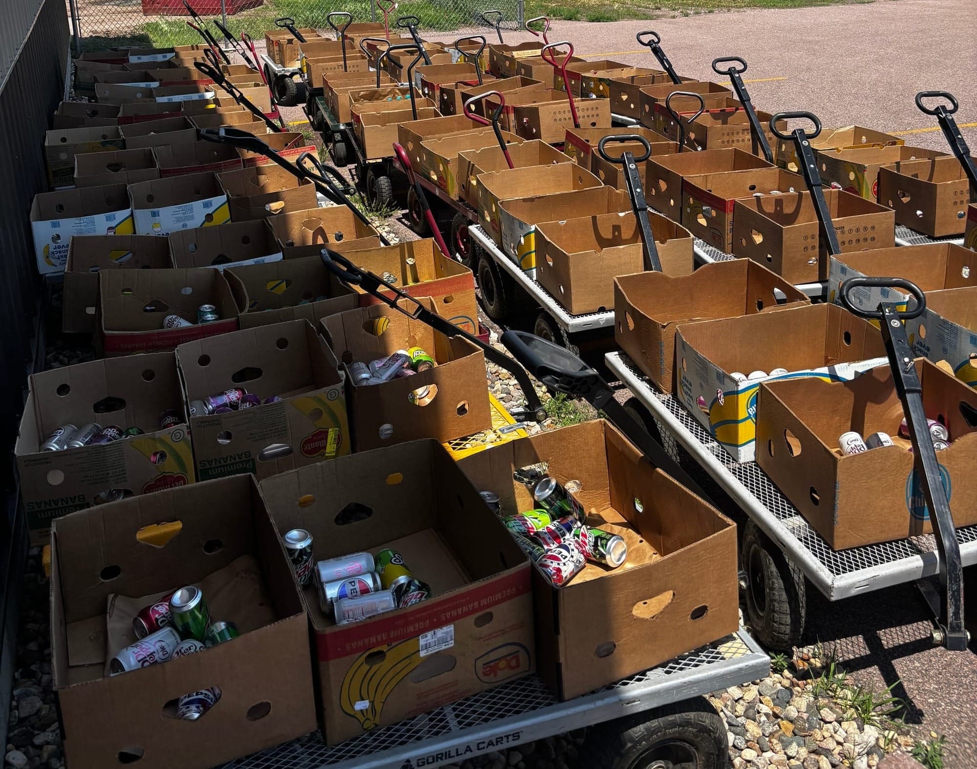 Boxes at the Faith Temple Food Giveaway in Sioux Falls, S.D., on June 27, 2025, to be loaded into cars.