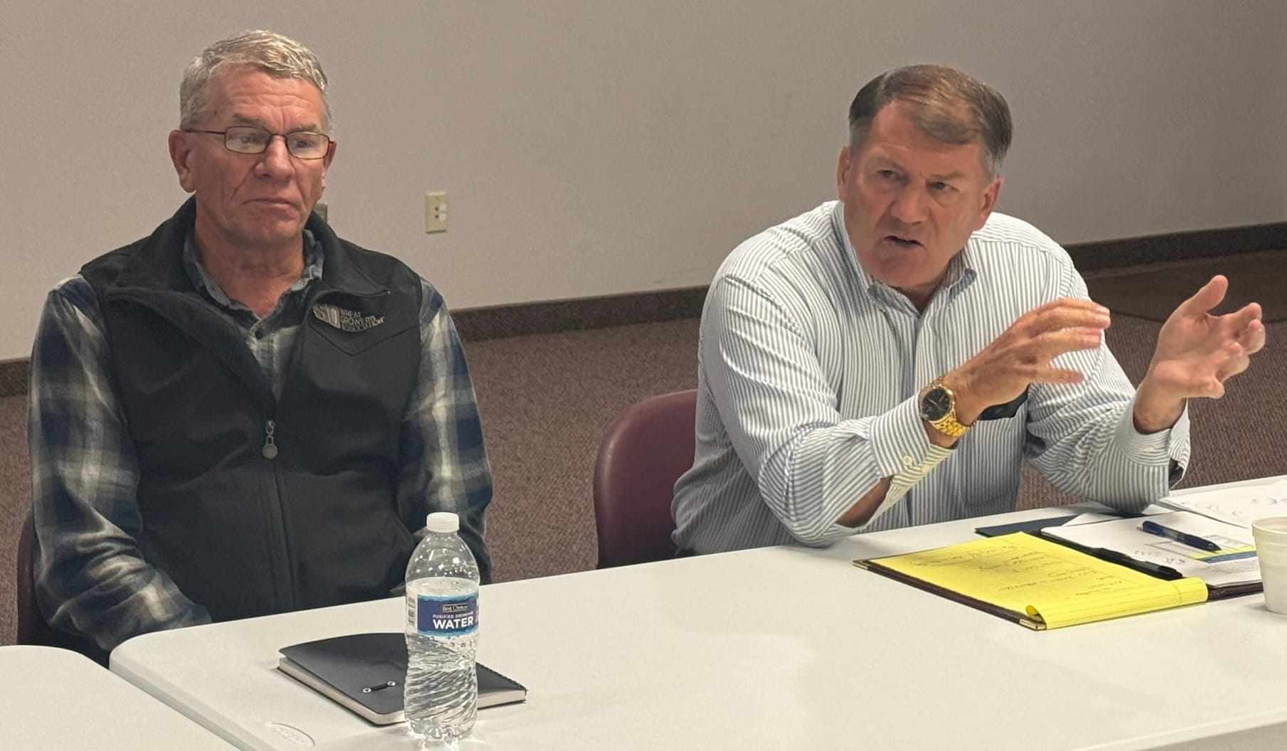U.S. Sen. Mike Rounds, right, speaks during a meeting in Pierre, S.D., on Sept. 22, 2025 with South Dakota row-crop farmers, including Doug Simons, left, president of the South Dakota Wheat Growers Association. (Photo: Bart Pfankuch / South Dakota News Watch)