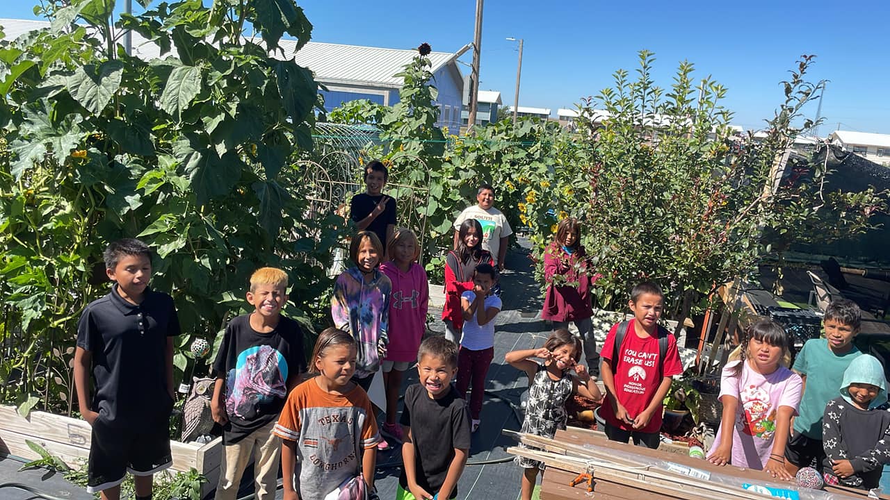 Members of the Rosebud Boys and Girls Club at the club's vegetable garden in Parmalee, S.D., on the Rosebud Indian Reservation. (Photo: Rachel Kocak)