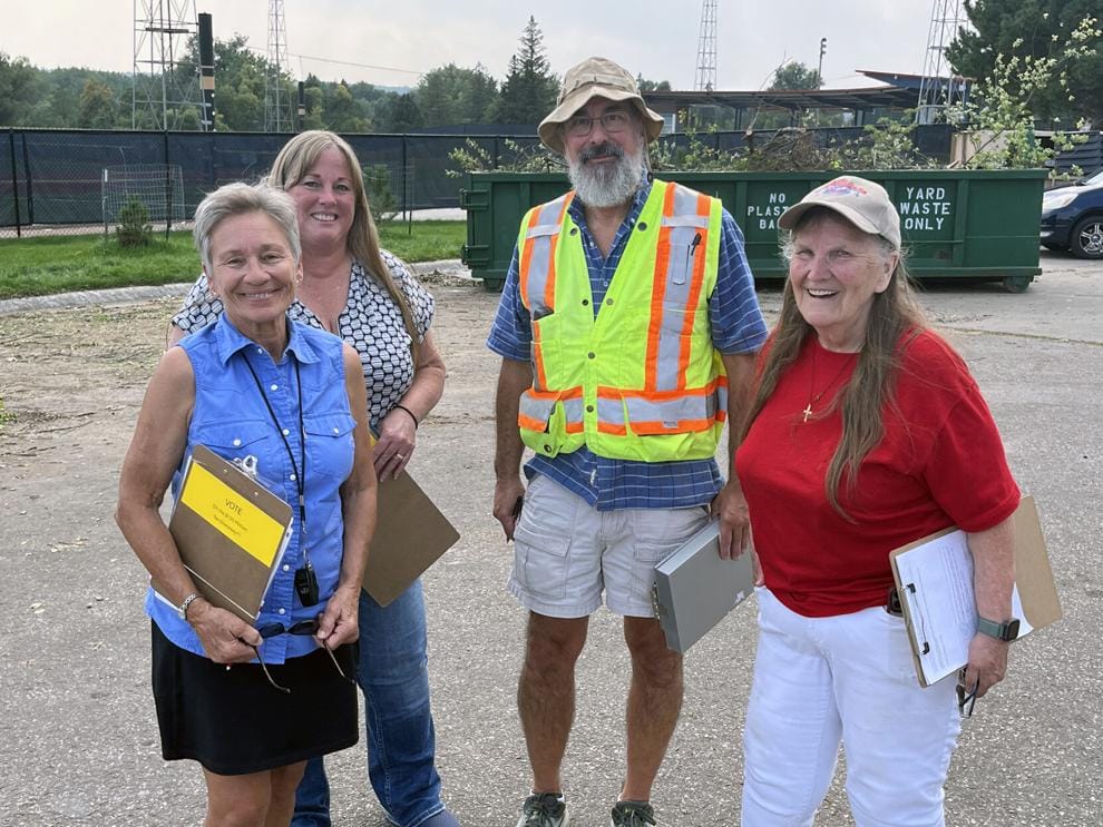 From left, Tonchi Weaver, Julie Frye-Mueller, Mike Hilles and Elaine Shepherd pose for a photo while out collecting petition signatures on Sept. 9, 2025, at the yard waste collection site at Fitzgerald Stadium in Rapid City, S.D. (Photo courtesy Mike Brownlee/ Rapid City Journal)