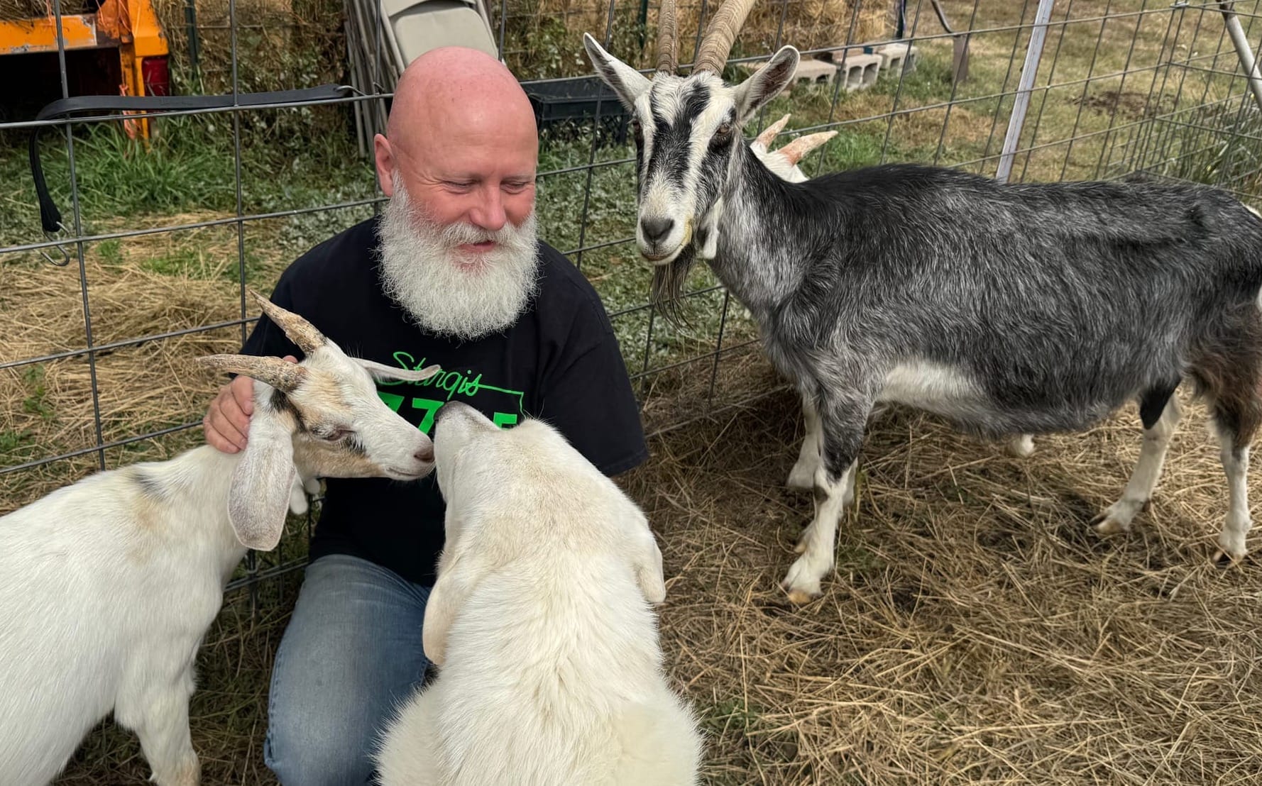 Rick Grosek on Sept. 18, 2025, with a few of the stars of the farm tours held at Bear Butte Gardens organic farm near Sturgis, S.D.