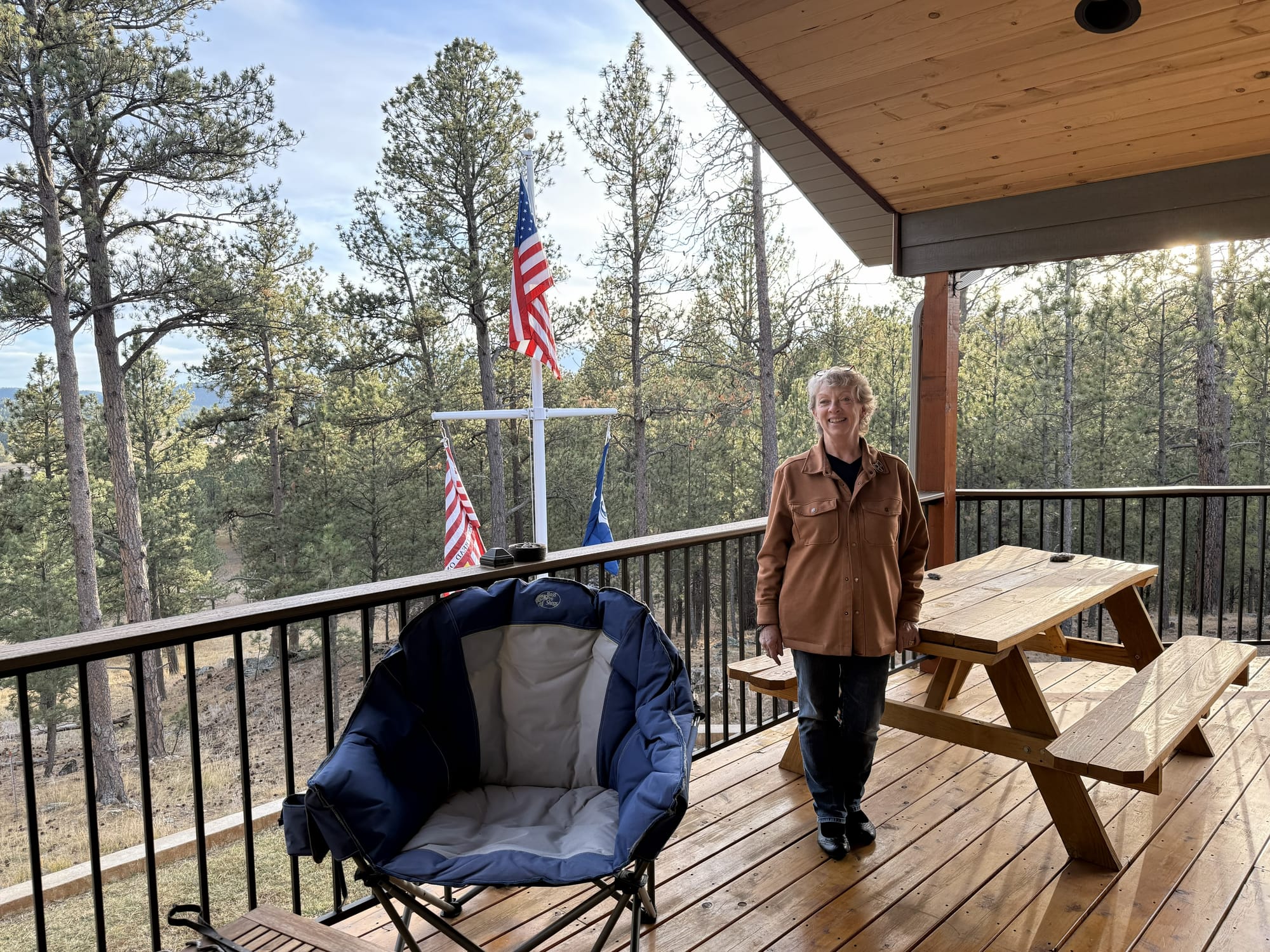 Custer County resident Lea Anne McWhorter stands on the patio of her home.