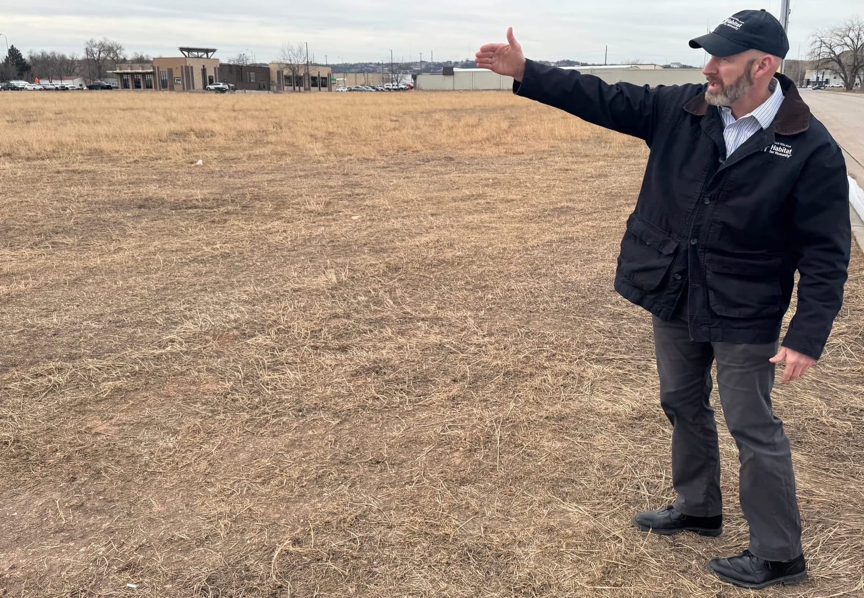 Mike Keegan, resource development manager for Black Hills Area Habitat for Humanity, on Jan. 28, 2026, at the site in southeastern Rapid City, S.D., where the nonprofit plans to build its largest-ever housing project.Mike Keegan, resource development manager for Black Hills Area Habitat for Humanity, on Jan. 28, 2026, at the site in southeastern Rapid City, S.D., where the nonprofit plans to build its largest-ever housing project.