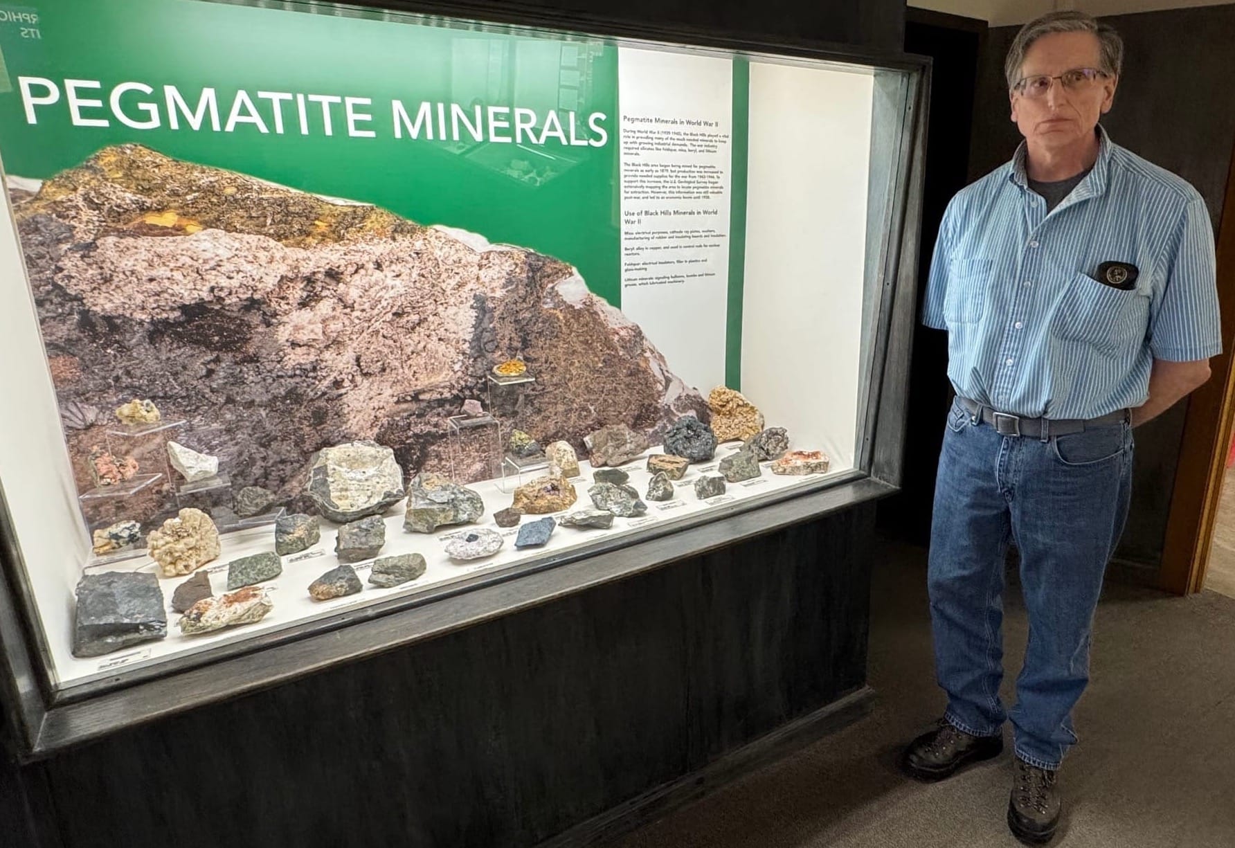 South Dakota Mines geology professor Christopher Pellowski stands in the university's geology museum in Rapid City, S.D.,