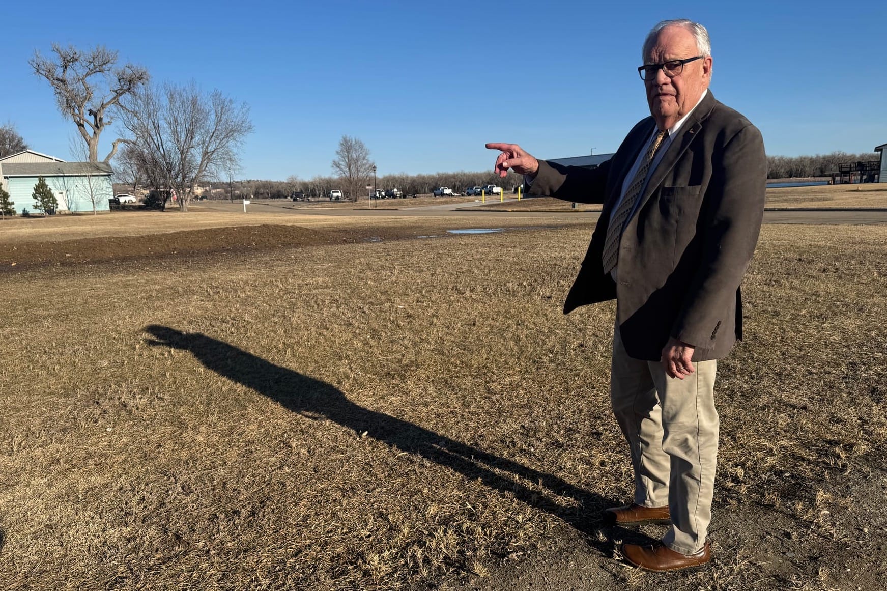 Dave Bonde stands on a lot owned by the U.S. Army Corps of Engineers in Fort Pierre, S.D., 