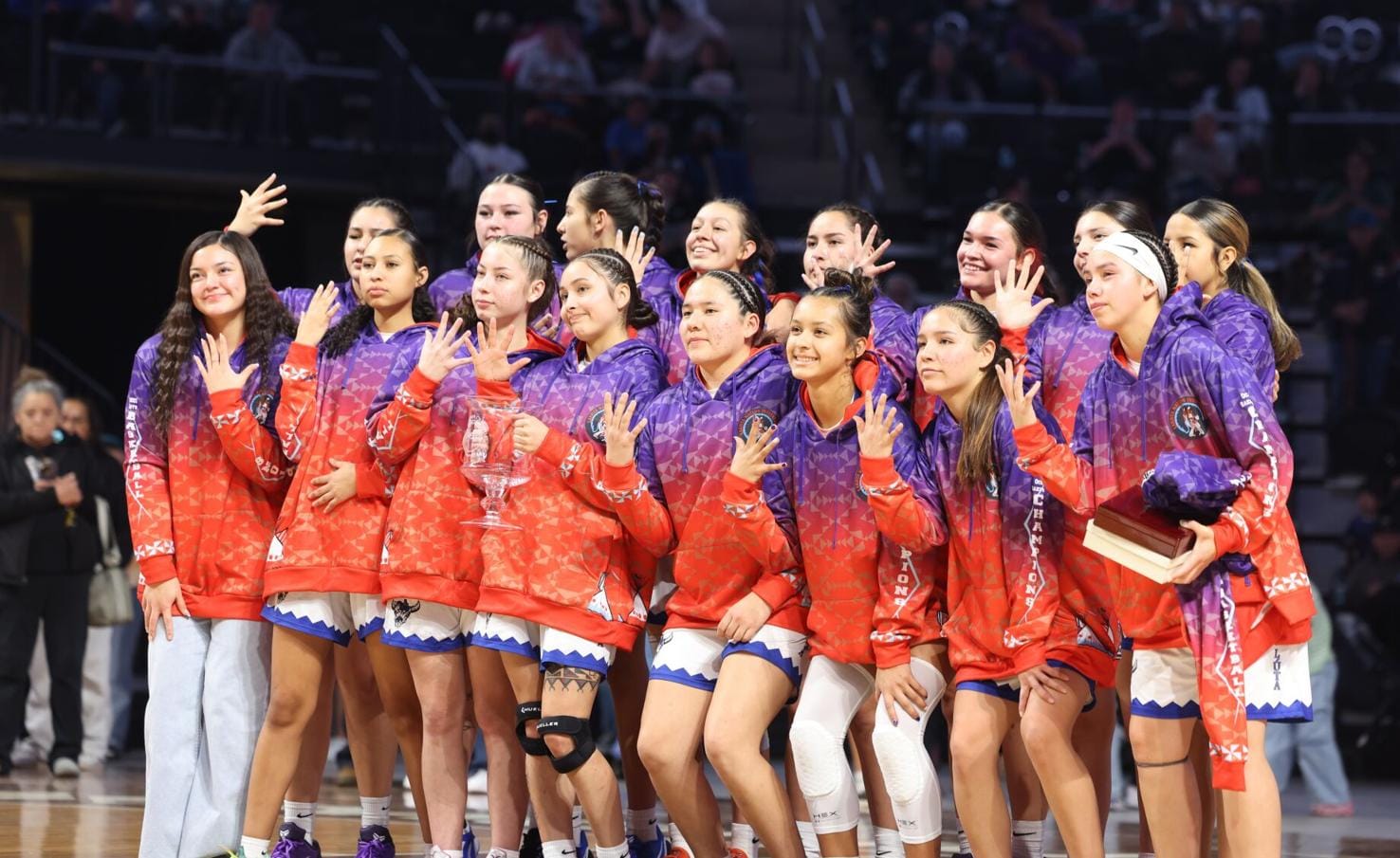 Maȟpíya Lúta celebrates its record fifth straight Lakota Nation Invitational title on Saturday