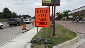 Is zipper merging more efficient for traffic than early merging?