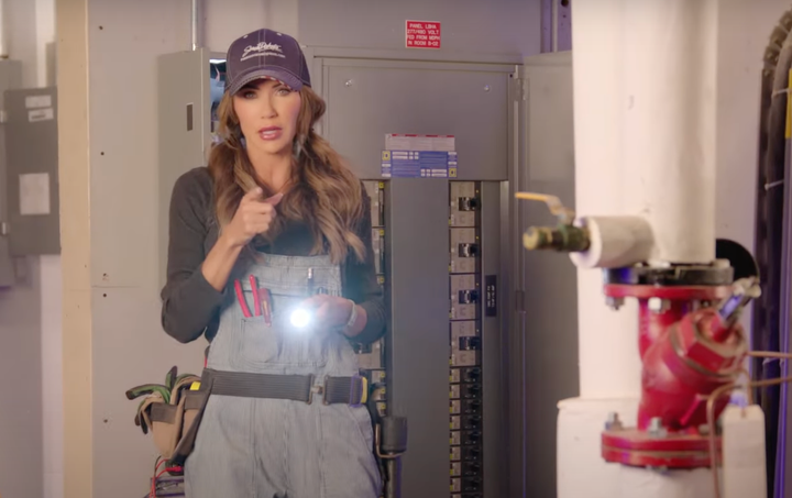 South Dakota Gov. Kristi Noem dressed as an electrician in a "Freedom Works Here" campaign ad.