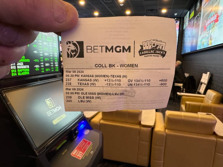 A sports betting ticket is held by a person at a casino in Deadwood, South Dakota