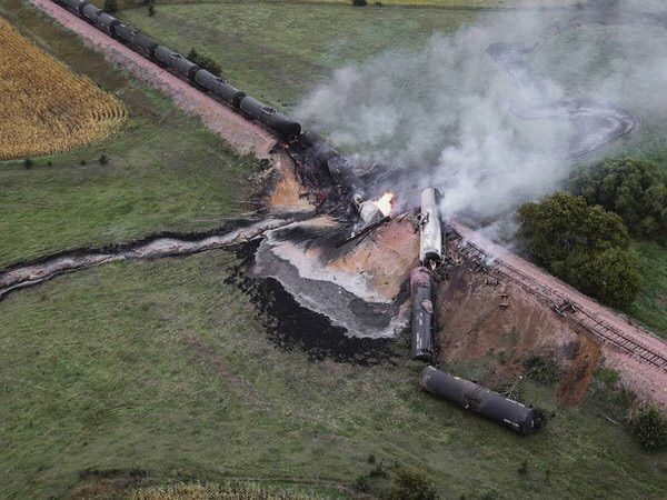Aerial view of train derailment in a field.
