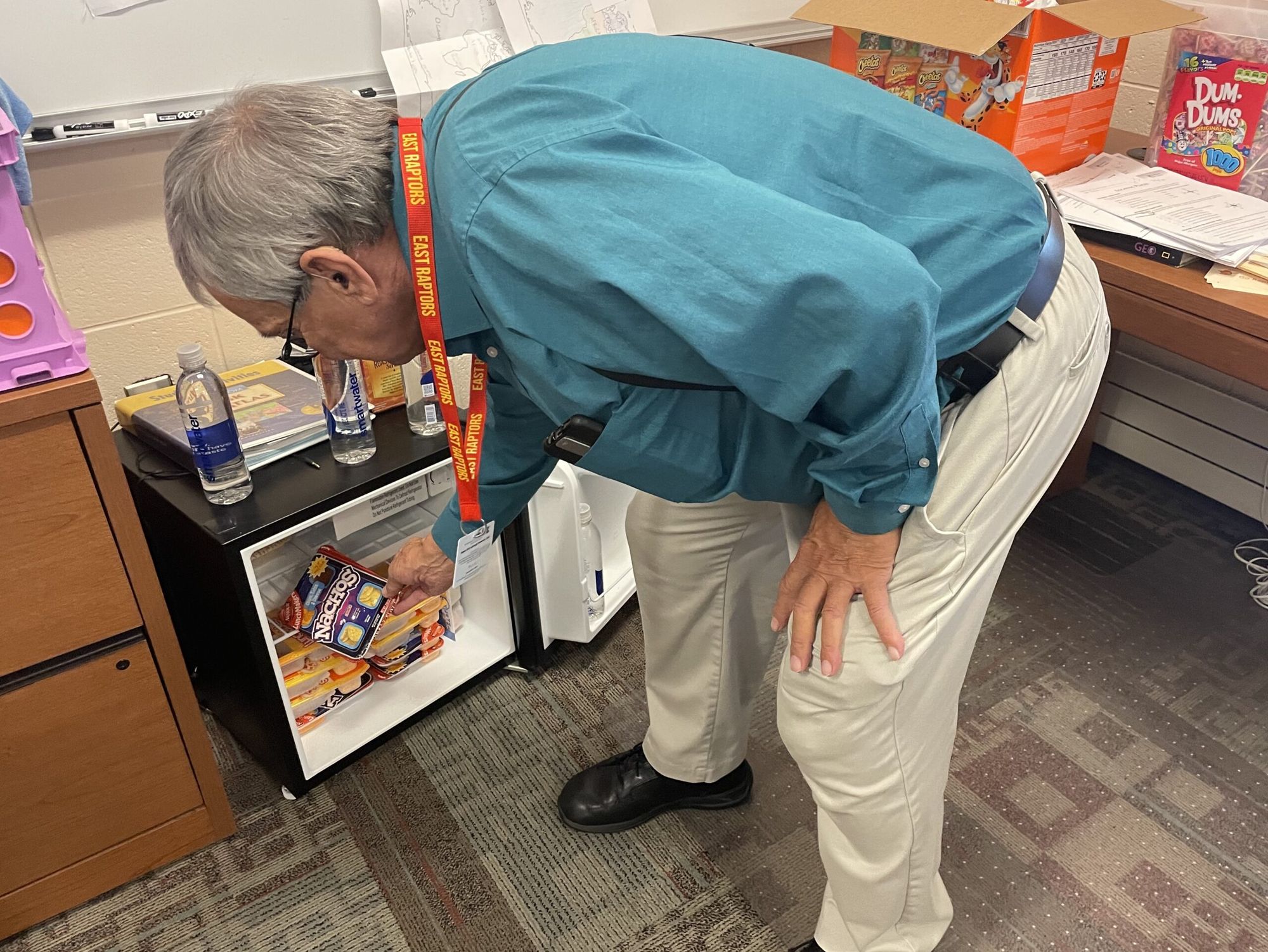 South Dakota teacher Bill Egan gives food to students