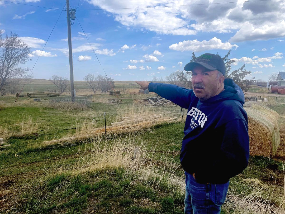 Joe Norman next to proposed gun range